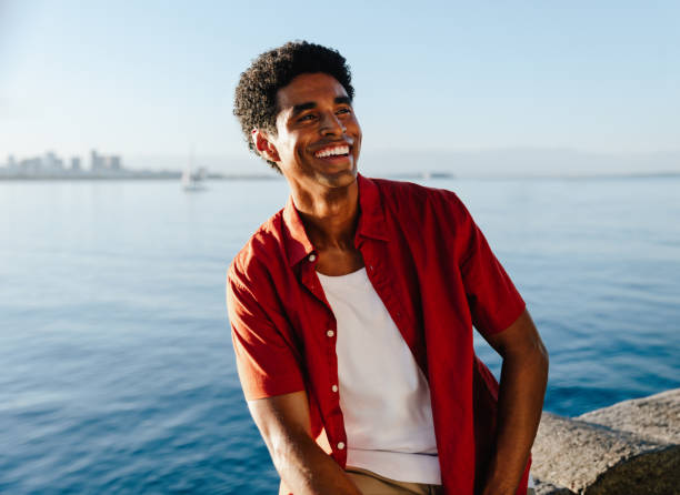 istock Joyful young man enjoying the day by Urca's wall 2204692242