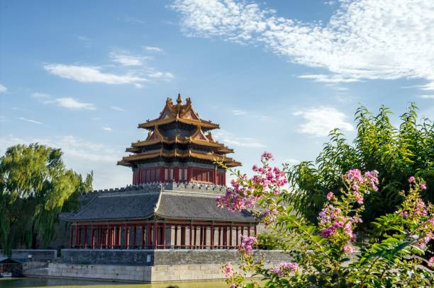 istock Traditional Chinese pavilion with flowers and blue sky. 2204693107