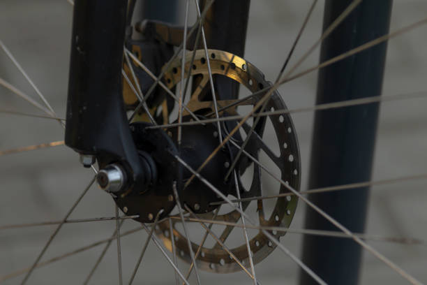 istock Close-Up of Bicycle Disc Brake and Fork Set Against Neutral Background 2204695099