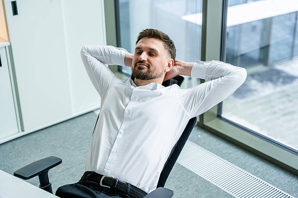 istock Businessman Relaxing in Modern Office Environment During Workday Break 2204695107
