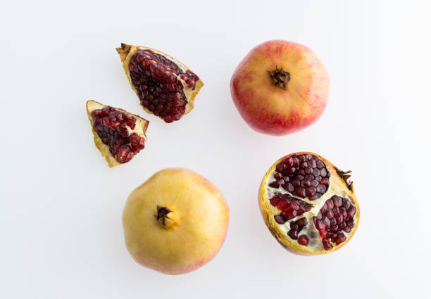 Pieces of pomegranate on white background.