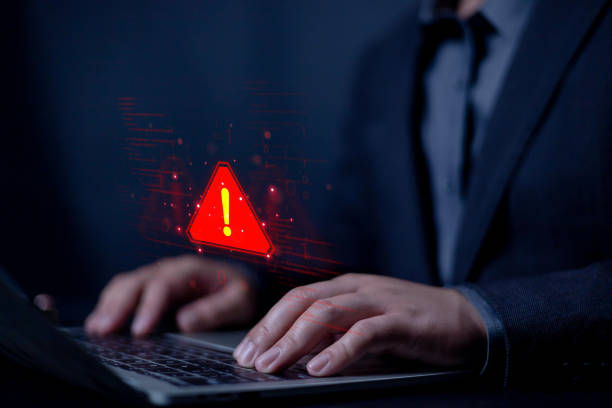 istock System hacked warning alert on laptop. junk and compromised information, Notification virus of hackercrime, Spam virus with warning caution or Malicious software. security protect 2204697829