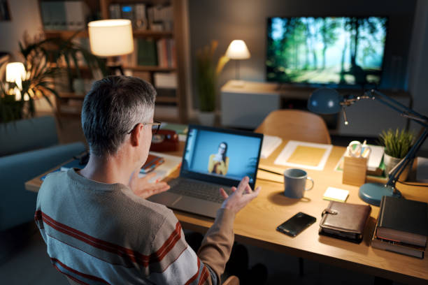 istock Man videocalling a woman on his laptop 2204698272