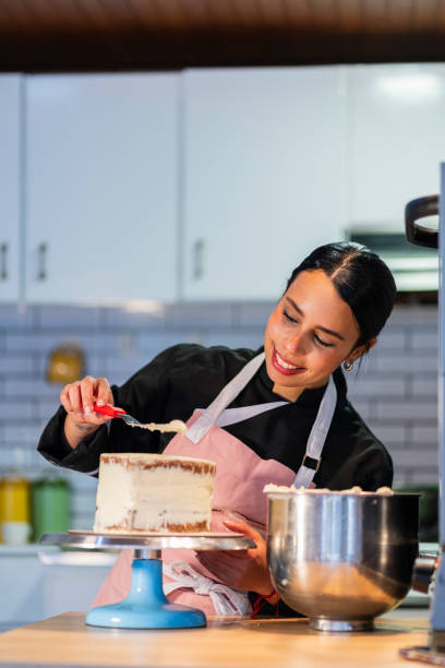 istock A young chef prepares a cake from the kitchen of the house using his utensils 2204703384