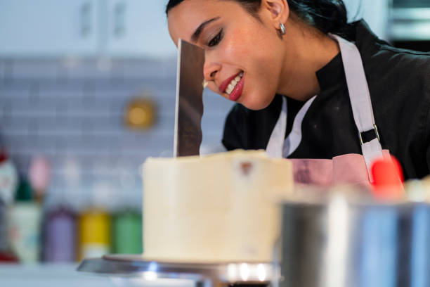 istock A young chef prepares a cake from the kitchen of the house using his utensils 2204703655