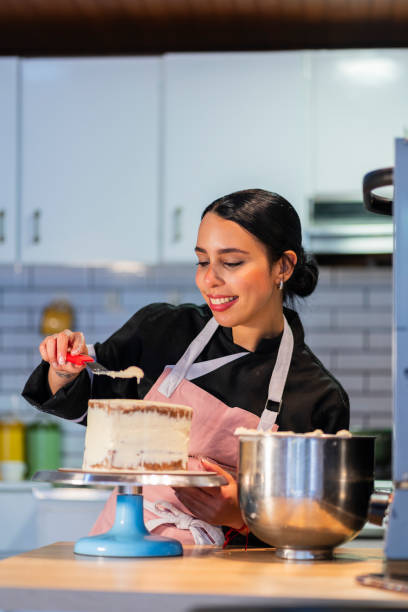 istock A young chef prepares a cake from the kitchen of the house using his utensils 2204704496