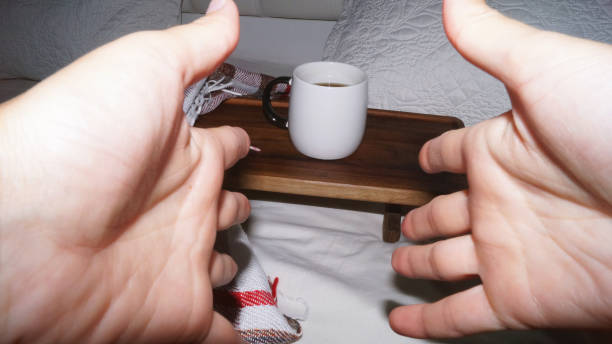 Woman's hands with red nails holding coffee beans. High quality photo