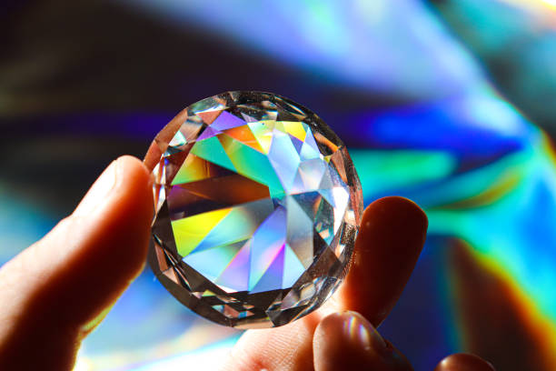 Holographic background. Diamond on shiny background. Rainbow effect.