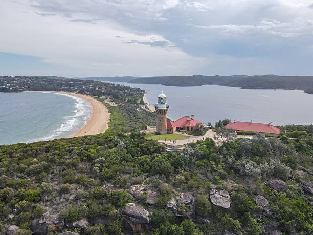 istock Aerial View of Lighthouse Overlooking Coastal Bay 2204708252