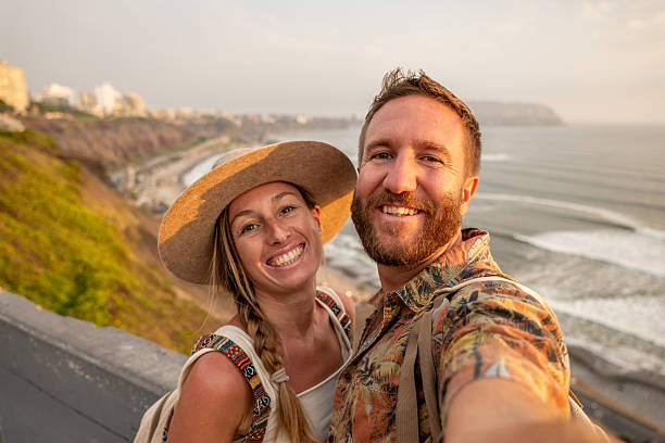 istock Couple taking selfie in Lima at sunset 2204709275