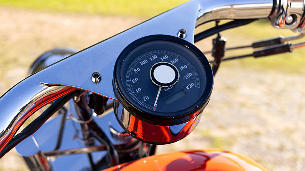 istock Close-Up of Motorcycle Speedometer on Custom Chrome Handlebar in Sunlight 2204710757