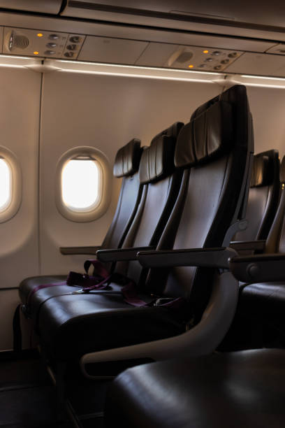 istock Empty Airplane Seats with Seatbelts Fastened – In-Flight Travel Comfort 2204710802