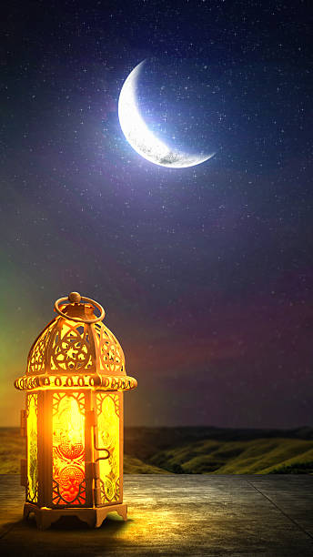 istock Traditional glowing Arabic lantern with crescent moon view on night scene background. Copy space or mockup. Concept of Eid Al Fitr and Ramadan Mubarak. Islamic background 2204713218