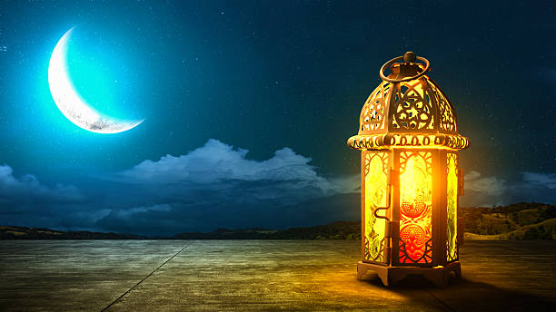 istock Traditional glowing Arabic lantern with crescent moon view on night scene background. Copy space or mockup. Concept of Eid Al Fitr and Ramadan Mubarak. Islamic background 2204713238