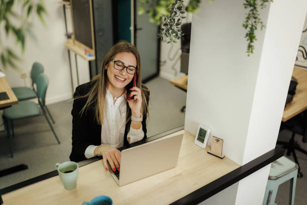 istock Businesswoman Multitasking in Modern Office 2204714133