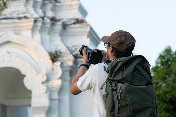 istock Asian traveling backpacker take a photo 2204715007