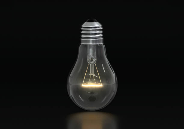 istock An incandescent light bulb is burning on a black background 2204715338