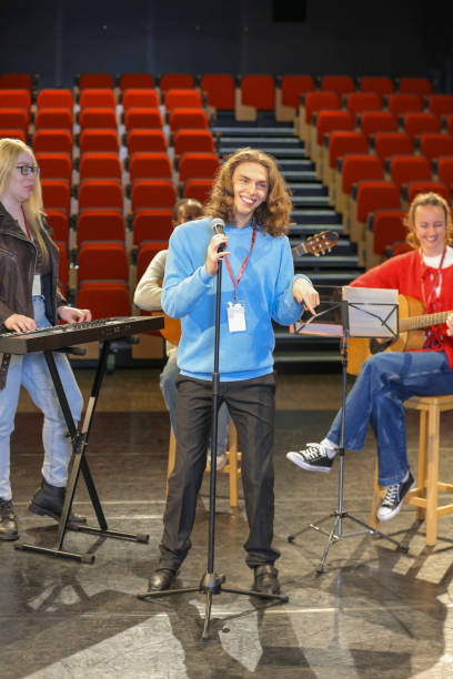 istock Persons with disabilities rehearsing music on stage 2204717813