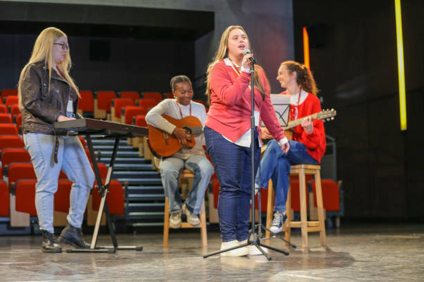 Group of people with disabilities performing music on stage