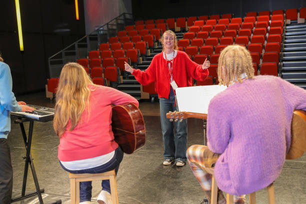 istock Persons with disabilities performing music on stage 2204718779