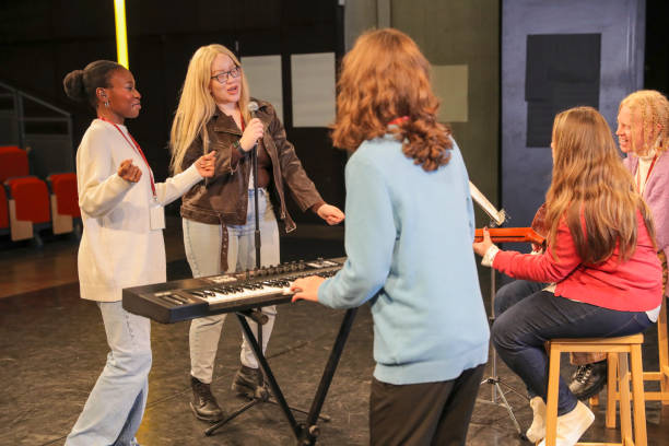 istock Persons with disabilities performing music on stage 2204718813