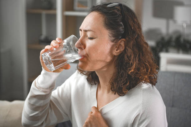 istock woman suffering from heatstroke at home 2204722323