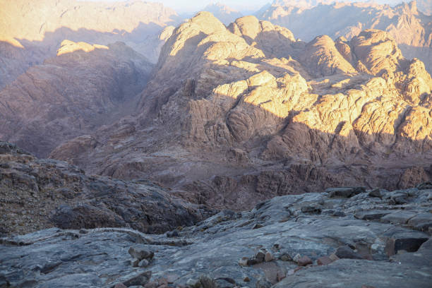 istock Mountain landscape with massive rocky peaks illuminated by sunlight 2204722462