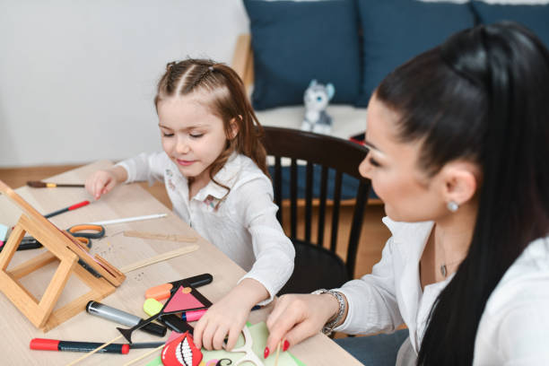 istock Daughter Expressing Creativity on Arts and Crafts Afternoon at Home 2204727636