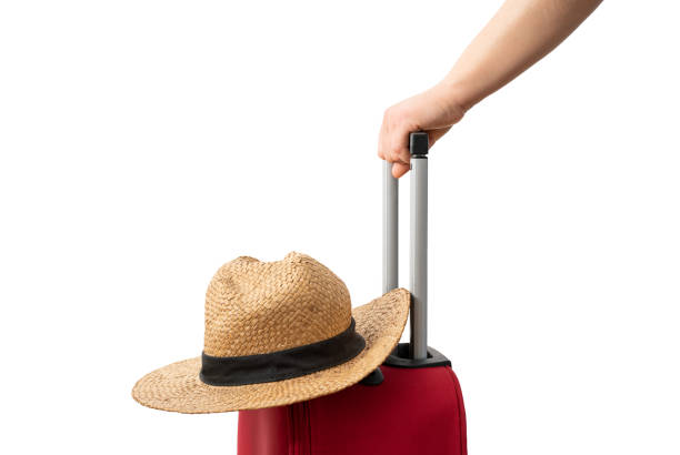 istock Woman with red suitcase and hat 2204727677