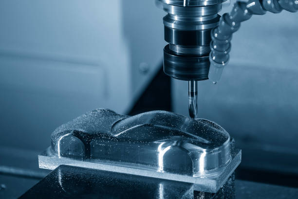 istock The CNC milling machine cutting  mold part by solid ball end mill tool in the light blue scene. 2204728366