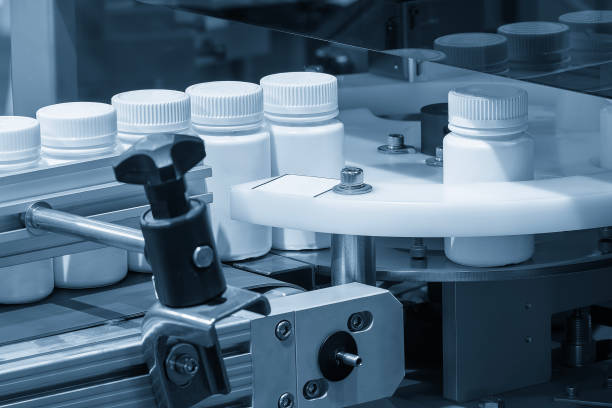 istock The medicine bottle filling process. 2204728375