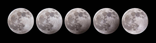 istock Composite of lunar eclipse stages, blood moon, night sky, cosmic event 2204729458