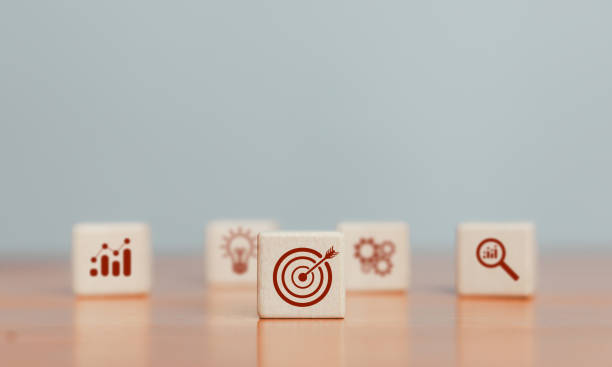 istock Target icon on wooden block. 2204731926