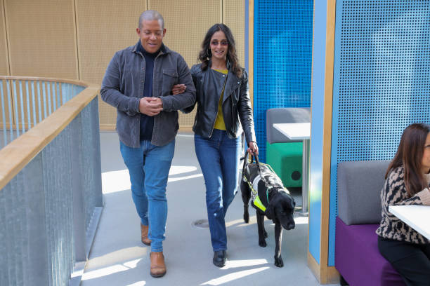 istock Man guiding visually impaired friend 2204732640