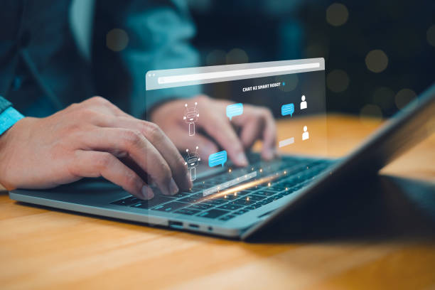 istock A business professional typing on a laptop with a futuristic digital interface displayed above the keyboard. 2204734397
