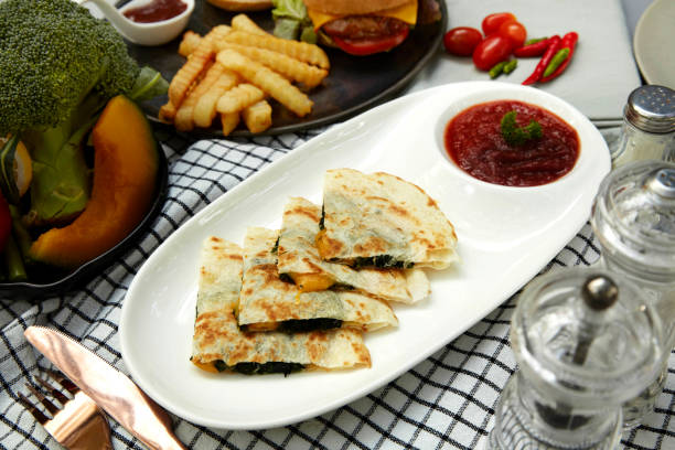 istock Cheesy Spinach Quesadilla with Tomato Salsa – A Flavor Mexican-Inspired Dish 2204734408
