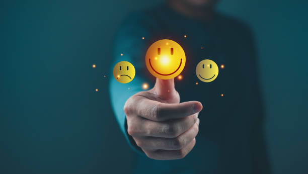 istock A hand giving a thumbs-up gesture with floating smiley faces, symbolizing positive emotions and feedback. 2204734659