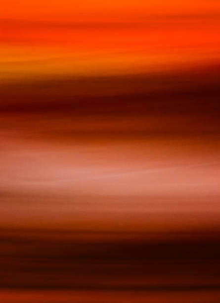 istock A breathtaking display of warm hues forms a smooth gradient across the canvas, with orange and brown swirling together elegantly 2204734925
