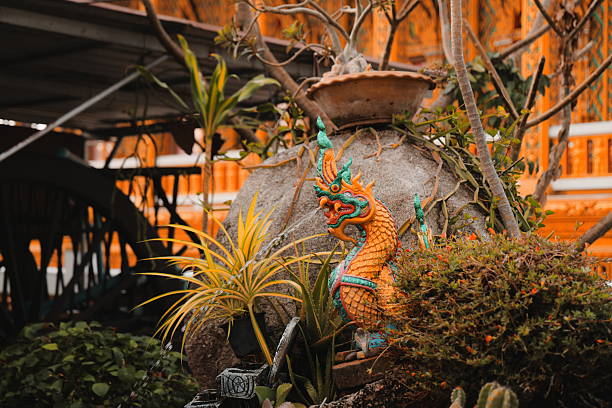 istock A Vibrant and Ornate Dragon Statue Elegantly Surrounded by Lush and Beautiful Greenery 2204735493