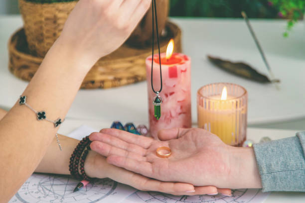 istock A woman fortune teller speaks to a man. Fortune telling, magic. Bright fortune teller. 2204738801
