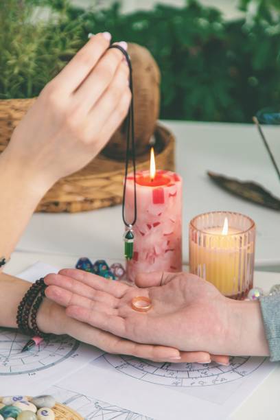 istock A woman fortune teller speaks to a man. Fortune telling, magic. Bright fortune teller. 2204738811