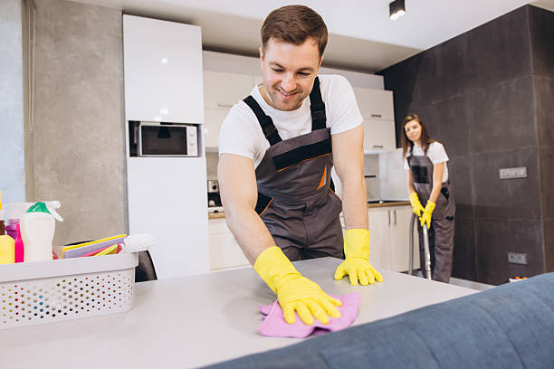 istock Cleaning company employees cleaning kitchen table and floor 2204739663