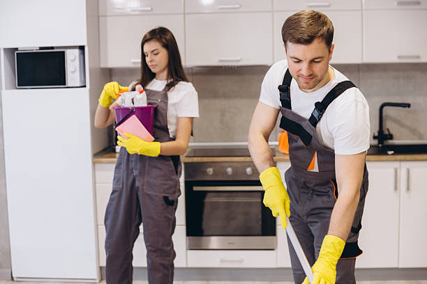 istock Cleaning company workers washing floor in kitchen 2204739876