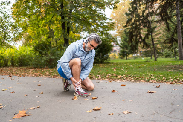 istock Man experiencing ankle pain during his workouts outdoors 2204740168