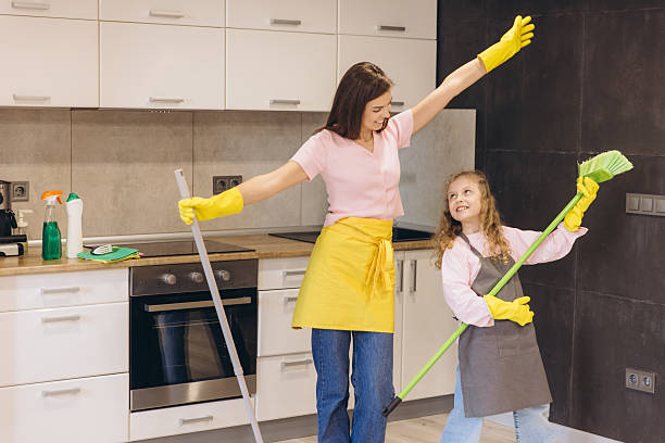 istock Mother and daughter having fun cleaning the kitchen floor 2204741256