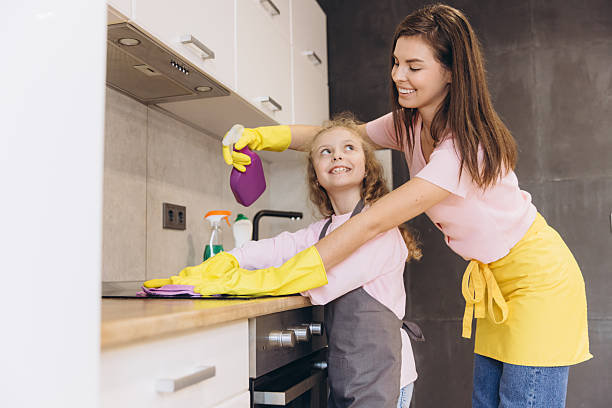 istock Mother and Daughter Cleaning Kitchen Counter Together 2204741314