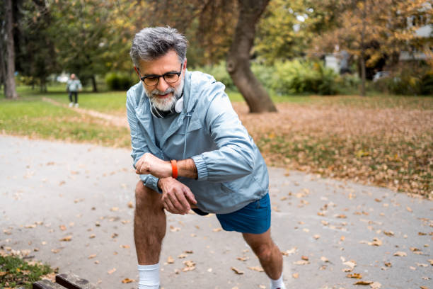 istock Mature man using a fitness tracker 2204741363