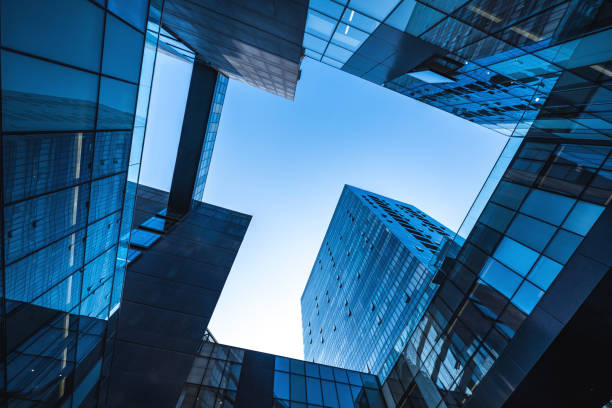 istock Modern Glass Skyscrapers Forming Symmetric Patterns Against a Clear Sky 2204745181