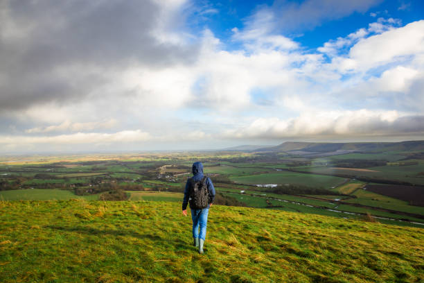 istock Male hiker walking on South Downs in southeast England 2204745975