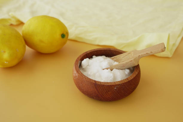 istock Baking soda and whole lemon on table 2204746966